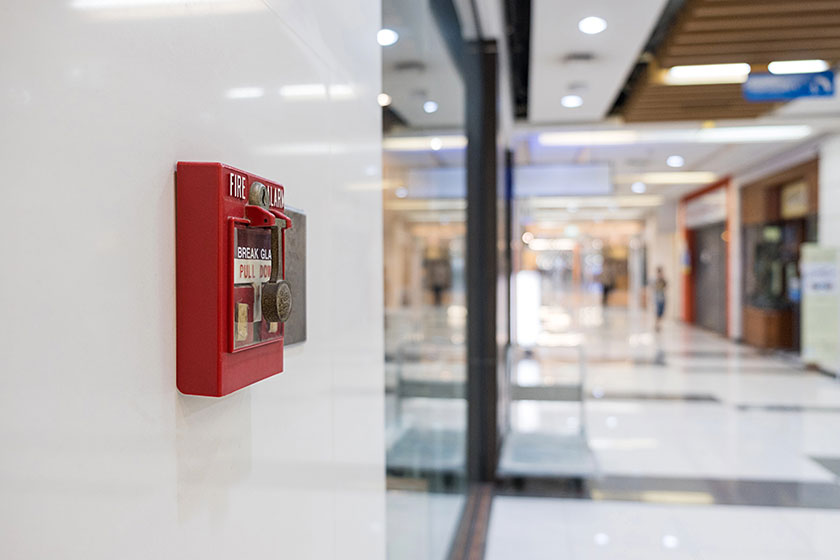 Fire alarm on the wall of shopping mall warning and security sys